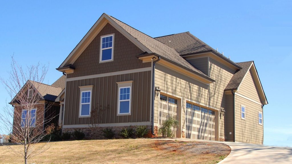 front entrance and garage door renovation improves curb appeal and largest return on investment